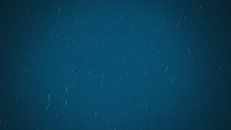 Digital-animation-of-white-particles-falling-against-blue-background