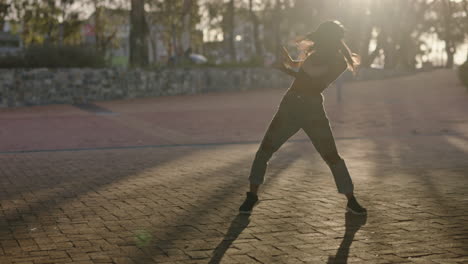 dancing woman young hip hop dancer in city enjoying fresh urban freestyle dance moves practicing expression at sunset