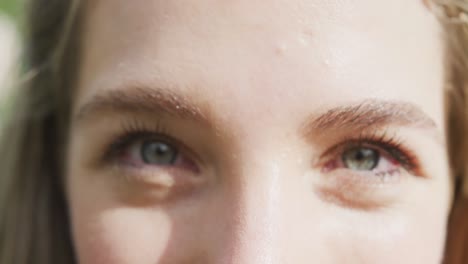 close up of portrait of happy caucasian woman on sunny day at wedding