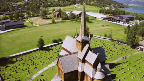 bird's eye view of lom stave church surrounded with tombstones at daytime in norway