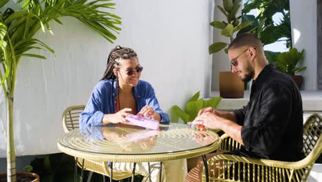 Couple-sitting-on-a-terrace