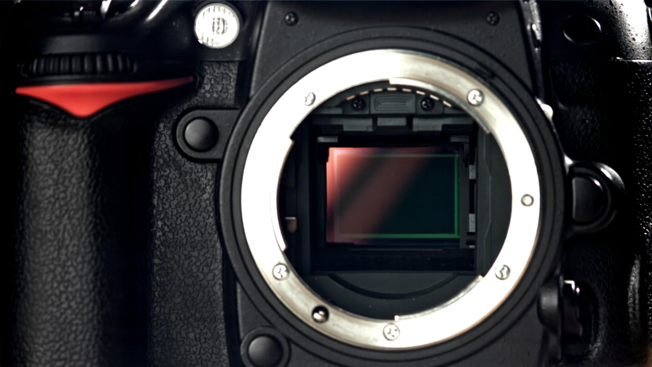 Close-up of DSLR Camera Shutter Firing and Revealing Sensor