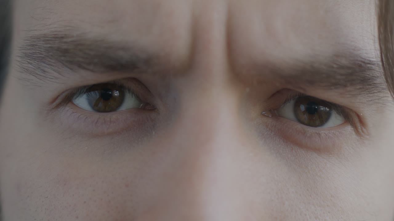 Close-up of a man's face with a serious expression