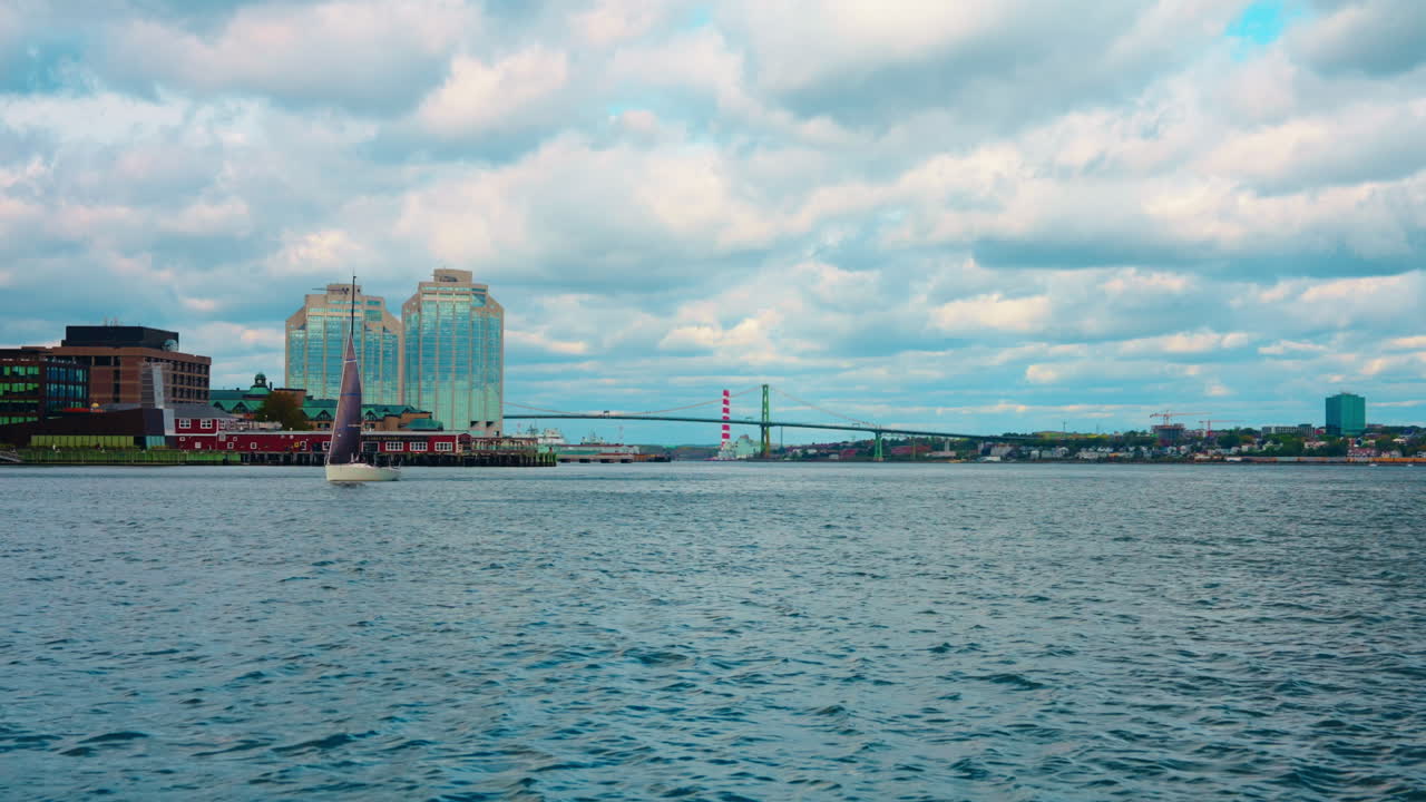 Boat tour exploring Halifax Downtown in Nova Scotia, Canada. Waterfront Skyline of the city. View of the financial district. Sightseeing of Halifax.