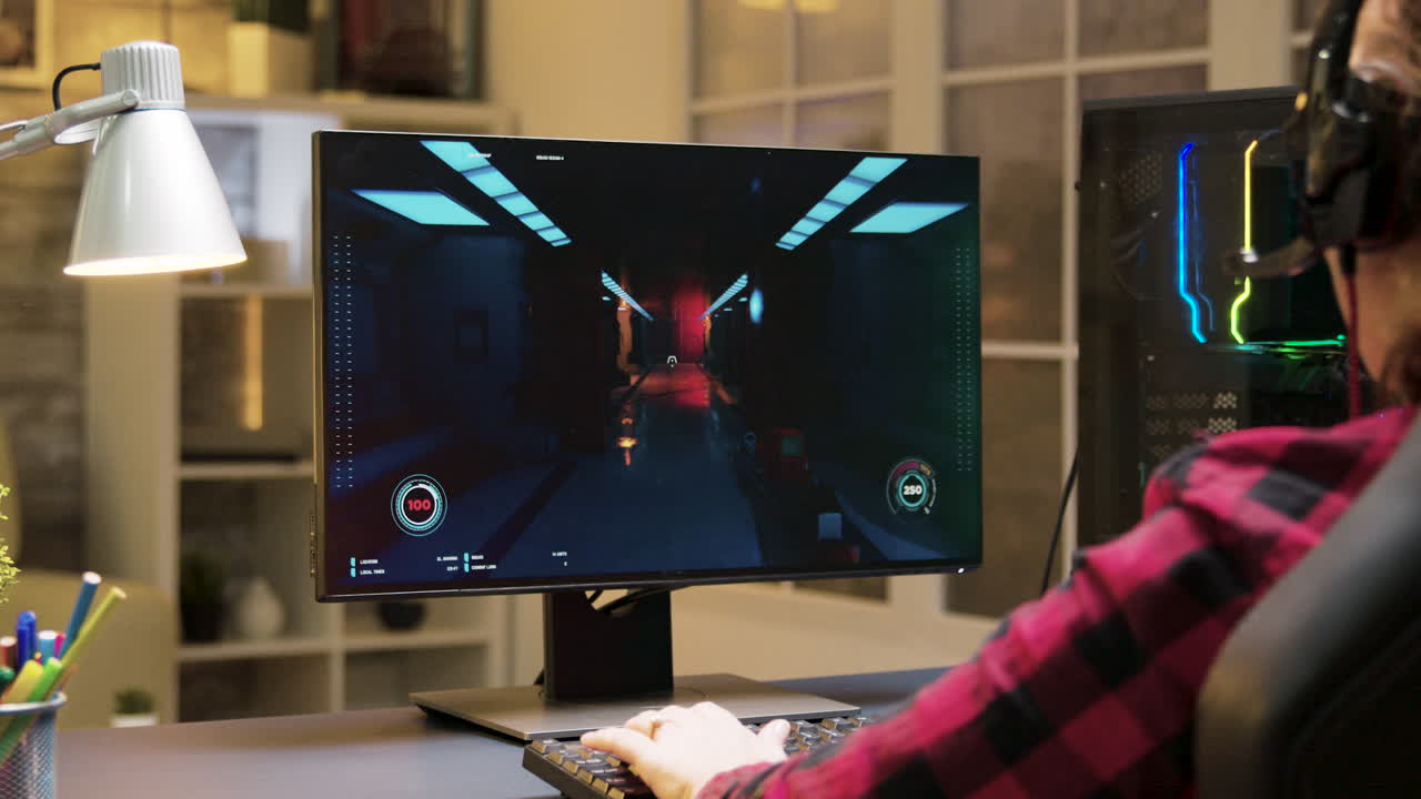 Gamer playing video game on computer