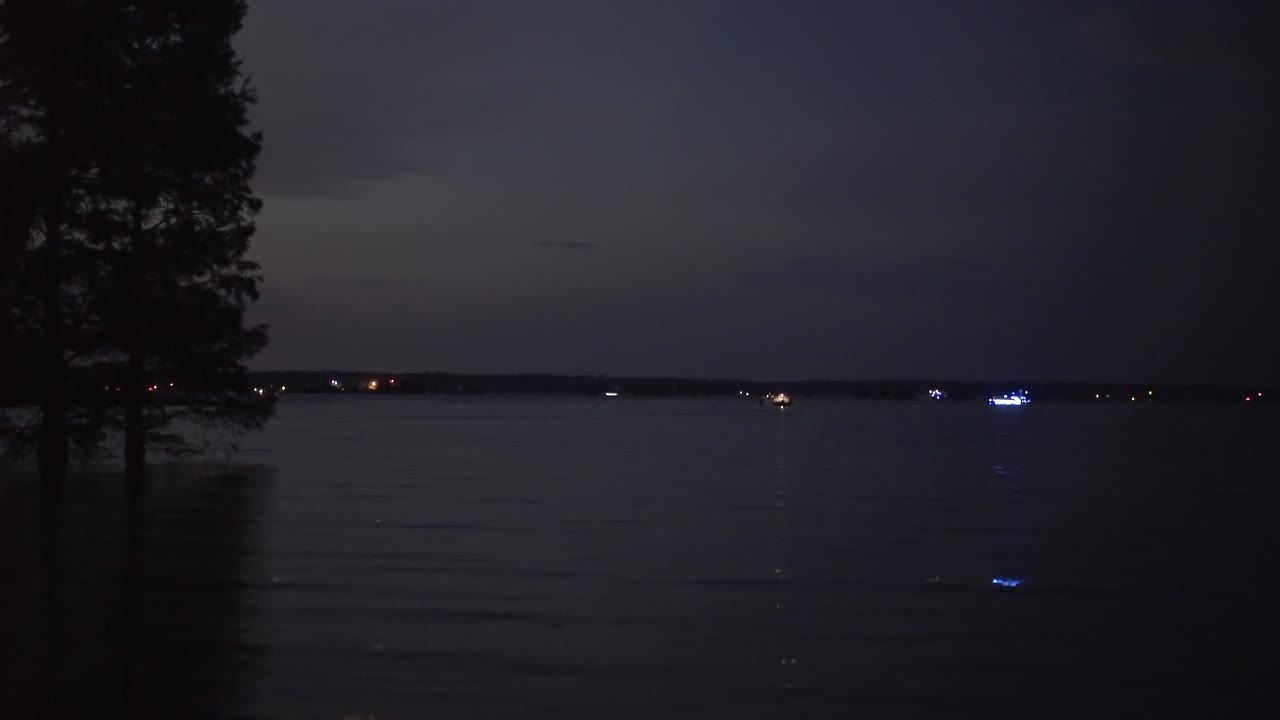 Boats on the calm water in the dark