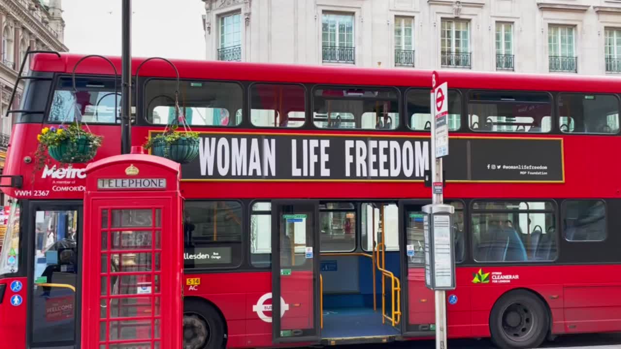 Red Double-Decker Bus and Telephone Booth in London