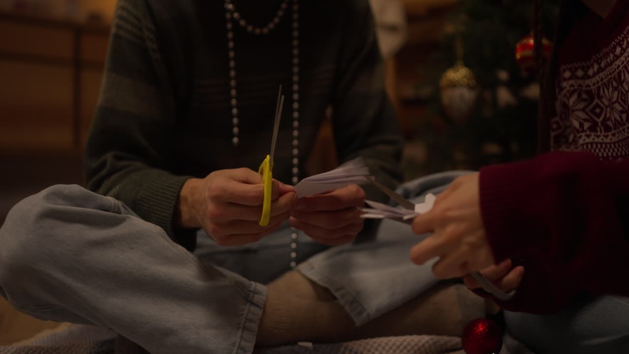 Couple Making Christmas Decorations