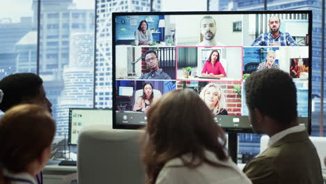 company employees attending a meeting via videocall with investors