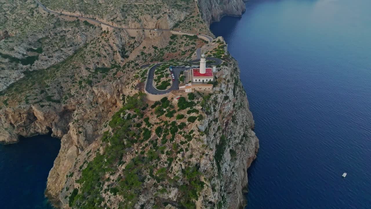Drone pullback at blue hour at Formentor lighthouse, Serra de Tramuntana Mallorca Spain