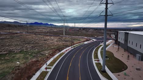 incredible aerial shot going between power lines at bringhurst station and redwood road street in bluffdale utah