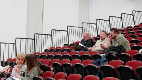 lecture hall facilities, sparse attendance, empty seats, spectator venue