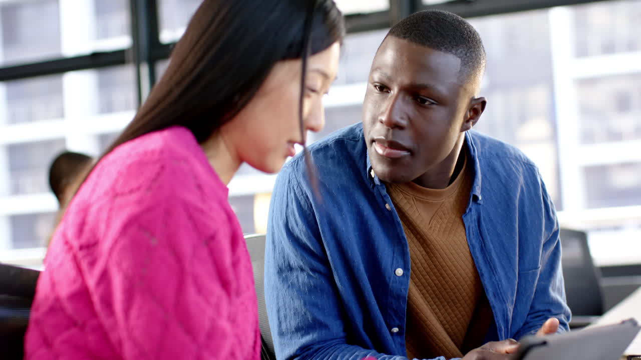 Diverse business people talking and working together in office, slow motion, copy space