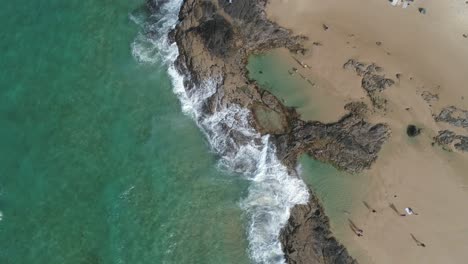 Bird's-eye-view-aerial-shot-rotating-down-of-the-champagne-pools-on-Fraser-Island