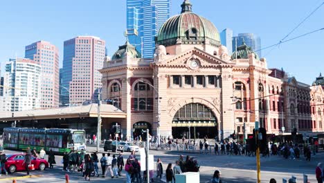 trams and pedestrians at iconic melbourne landmark