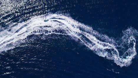aerial view of jet skis on the ocean