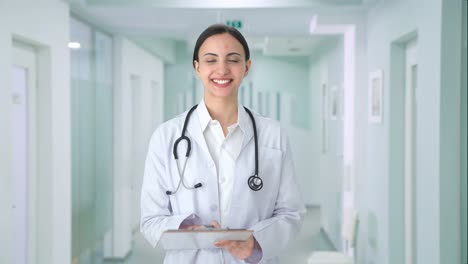 Happy-Indian-female-doctor-checking-patient