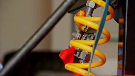 closeup of gloved hands adjusting pressure tool with rubber grip and cable loop in use