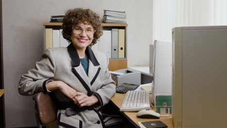 caucasian businesswoman working sitting at desk.