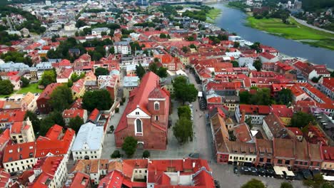 Drone-shot-over-Kaunas-old-town-with-a-view-of-Kaunas-Cathedral-Basilica-and-red-house-roofs-near-the-Neris-river-in-Lithuania