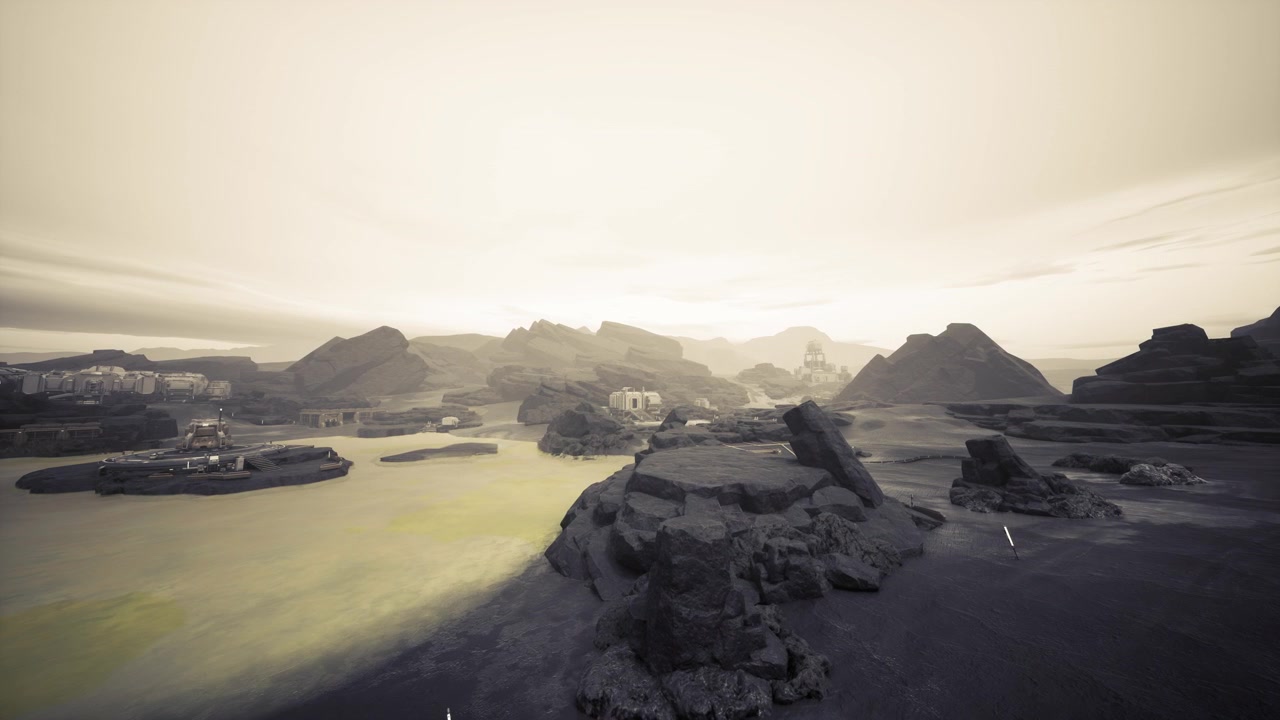Aerial view of sunrise illuminating jagged cliffs and calm waters