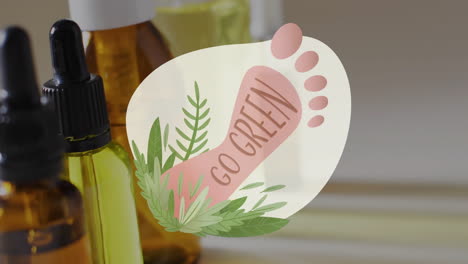 animation of go green text, barefoot and plants logo, over natural oils on grey background