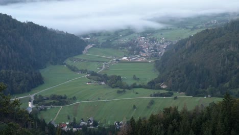 viewpoint in slovenia looking over lake bohinj with a cloud inversion