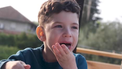 little kid enjoys delicious ice cream during the summer