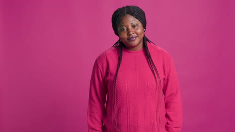 lady in pink outfit laughing for camera