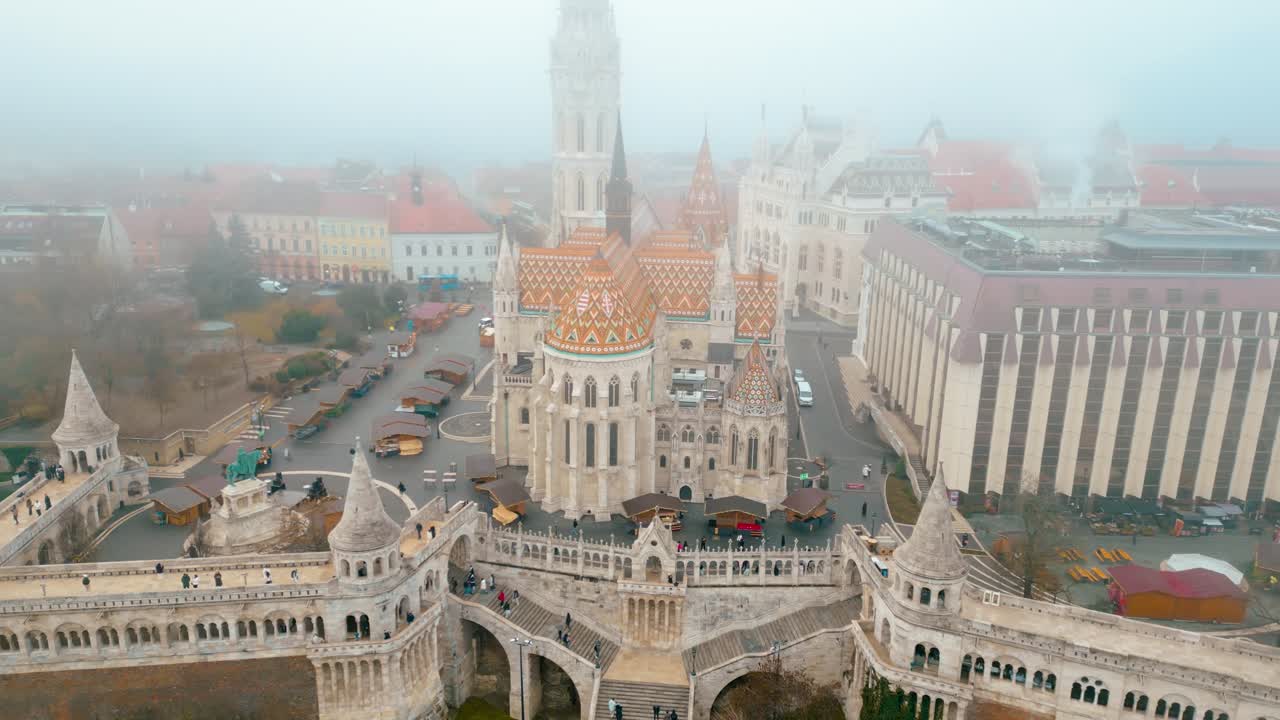 Cinematic aerial horizontal pan around the Fisherman's Bastion shrouded by mist