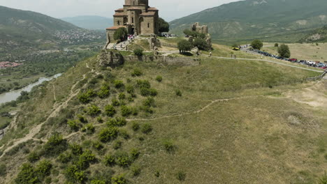 tourists at the jvari monastery on the mountaintop near mtskheta, georgia