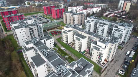 modern, secure residential complex with parking lots and playgrounds during springtime in poland