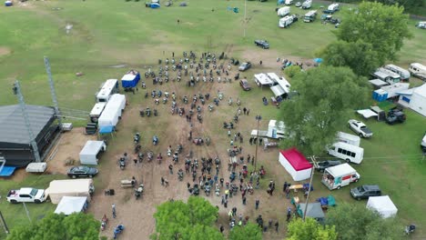 aerial, people crowded at a motorcycle rally on a field in america