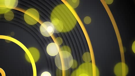 yellow and white bokeh light spots over moving concentric gold curves