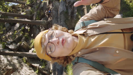 senior woman hiking and taking selfie in nature