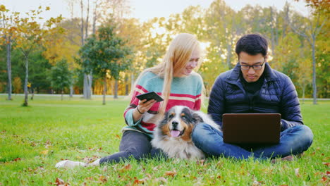 Friends-Relaxing-On-The-Lawn-In-The-Park