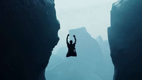 athlete jumping between towering cliffs in a foggy landscape, showcasing extreme sports and the thrill of adventure