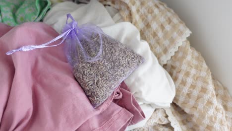 lavender sachet on a pile of clothes
