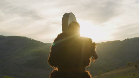 Man-conducts-battle-victory-ceremony-against-mountains