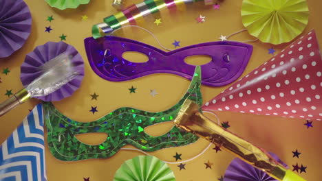 party hats, noisemakers, carnival masks and colorful decorations