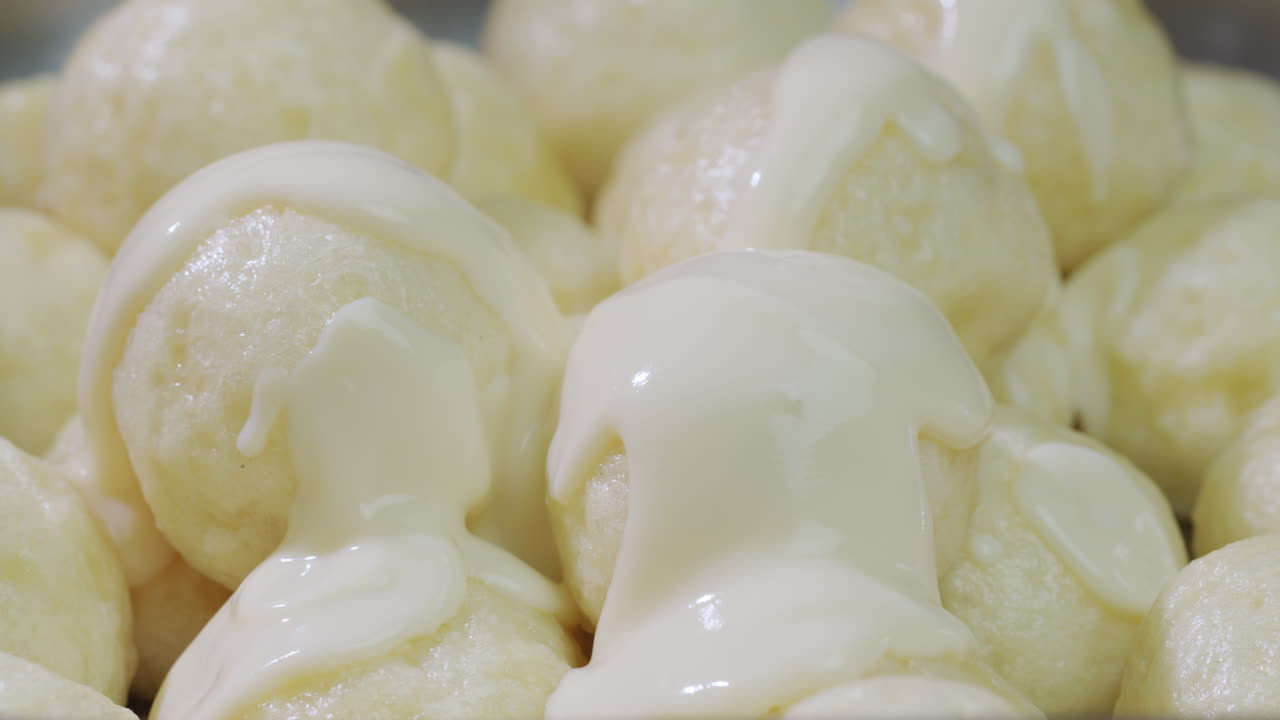 Dumplings are poured with delicious creamy sauce