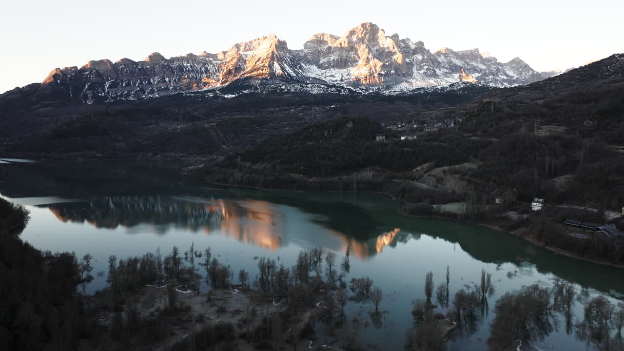 Sunrise over the Alpine Lake and Mountains