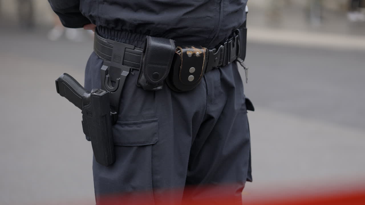 Police Officer's Duty Belt with Holstered Handgun