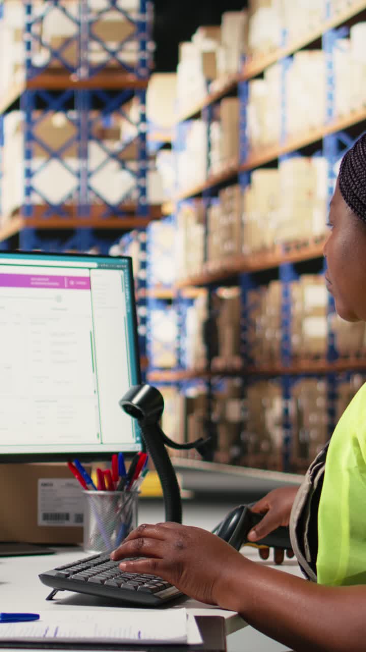Vertical Video Employee scanning awb tags after packaging operations in a distribution center