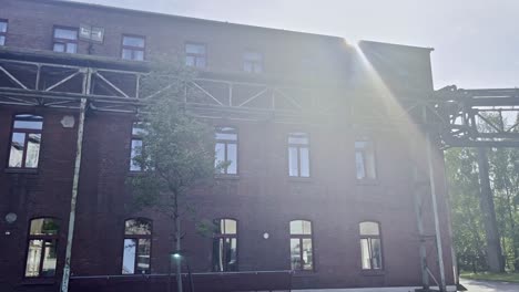 old brick house in the bright sun in the landscape park in duisburg on an old industrial site for steel production