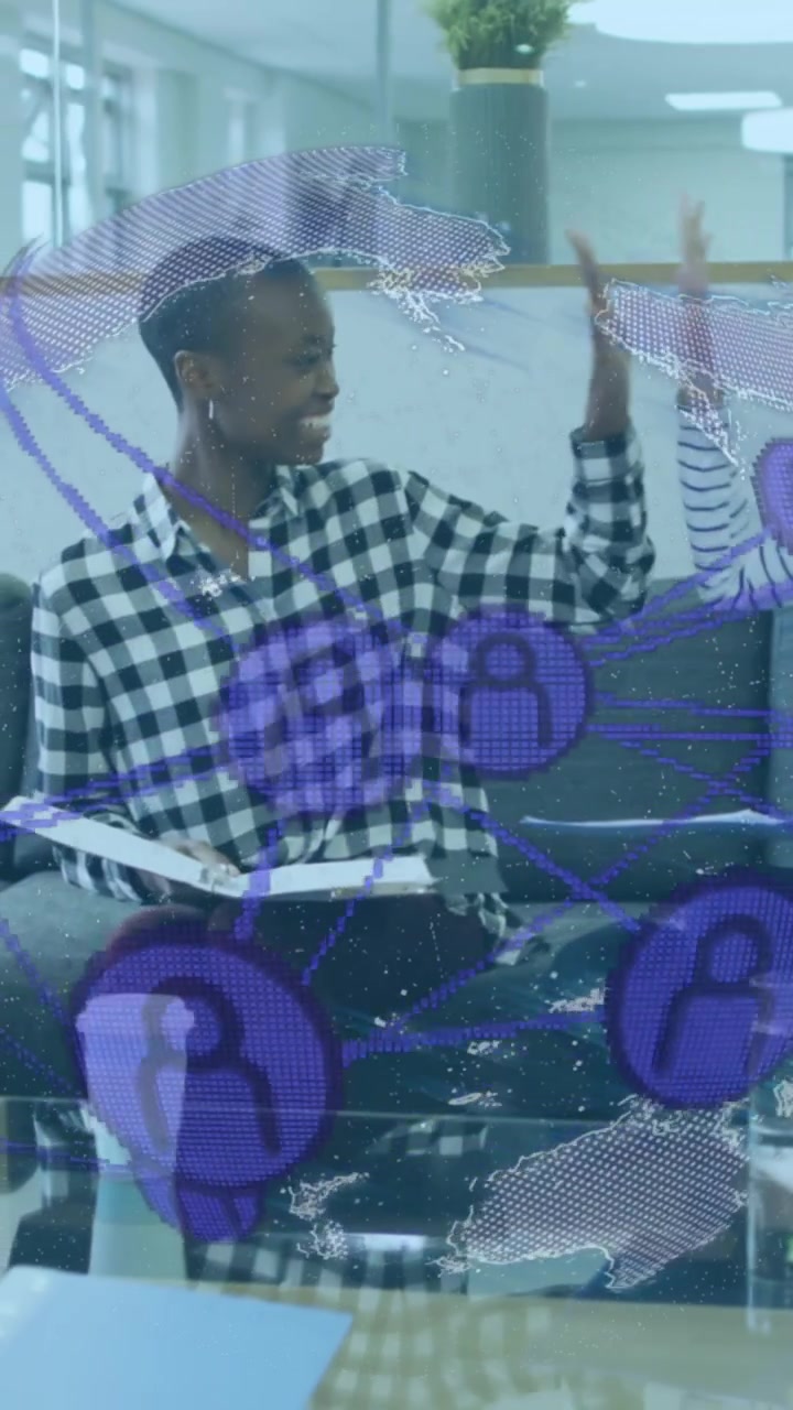Animation of globe with icons over diverse business people in office
