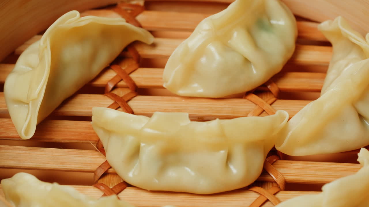 Close-Up of Freshly Steamed Gyoza in Bamboo Steamer
