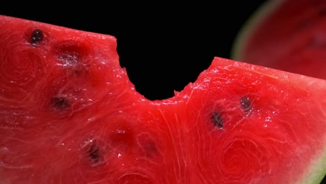 slice of watermelon with a bite in it