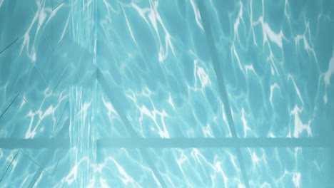 Serenity-in-Blue:-Light-Patterns-on-a-Pool’s-Surface-vertical