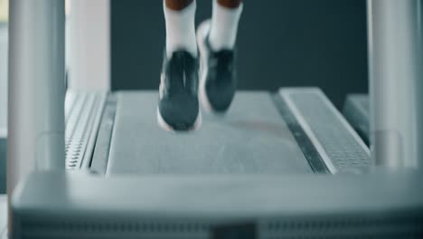 mans legs whilst running on treadmill